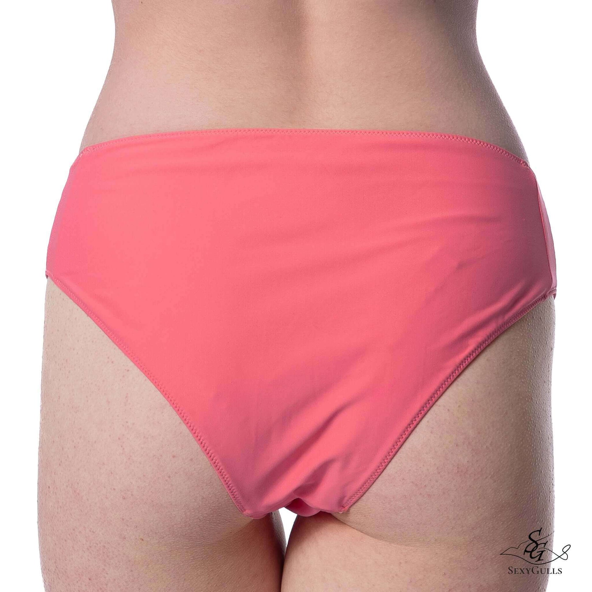 Back view of a woman in pink bikini bottom featuring full bum coverage