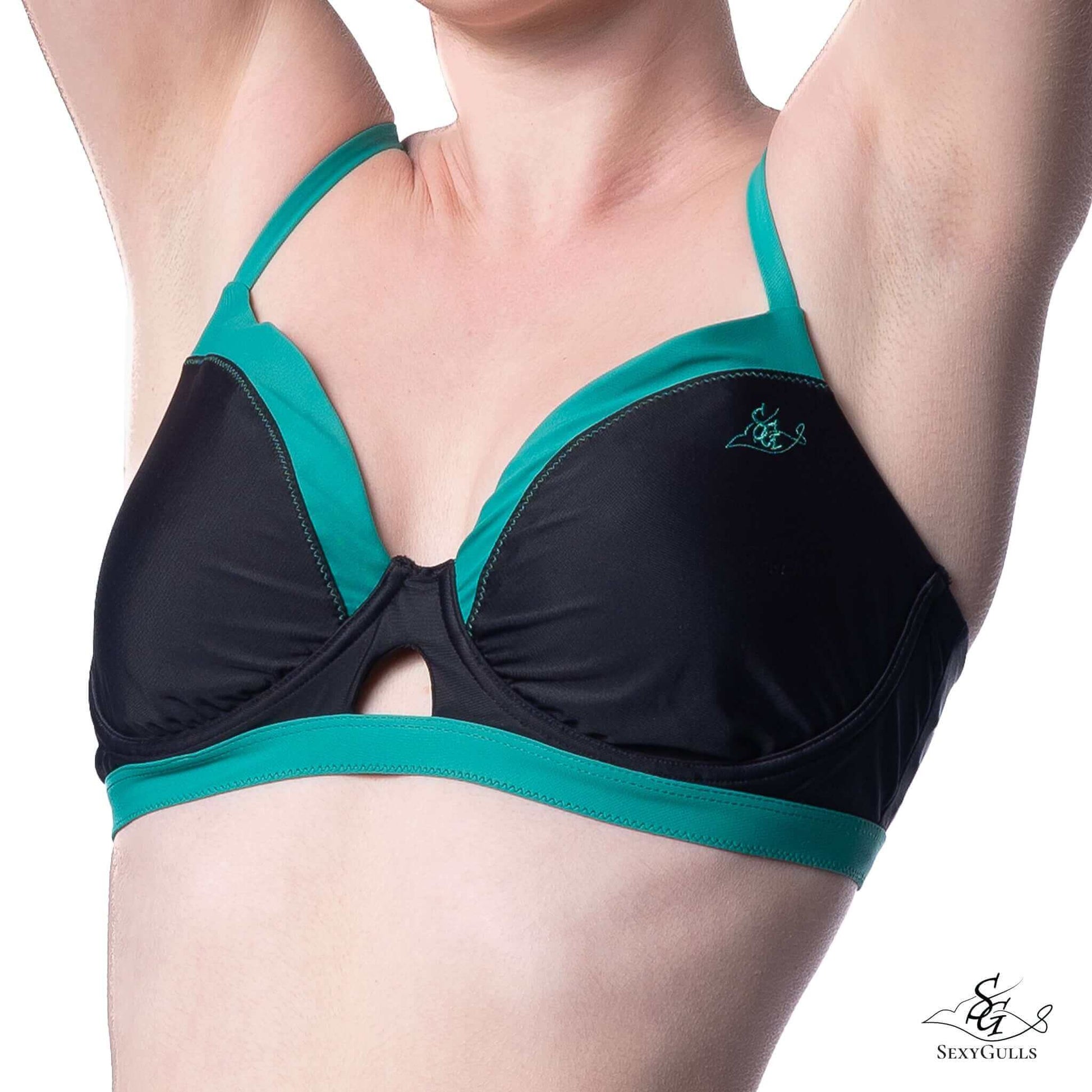 Zoomed in front view for cut-out design and green embroidered logo on two colours bikini top