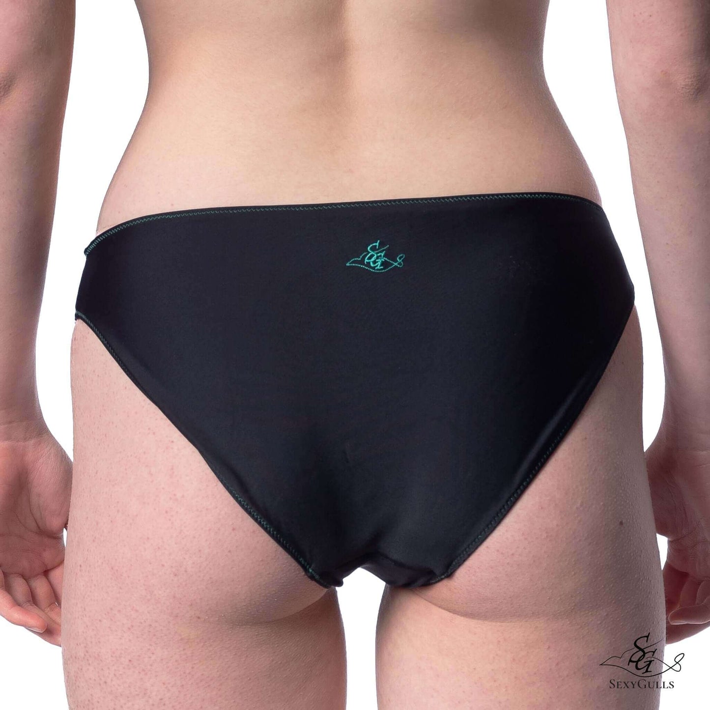 Back view of woman black full bum coverage bikini bottom with green embroidered logo.