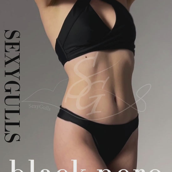 video of model wearing black halter bikini in studio