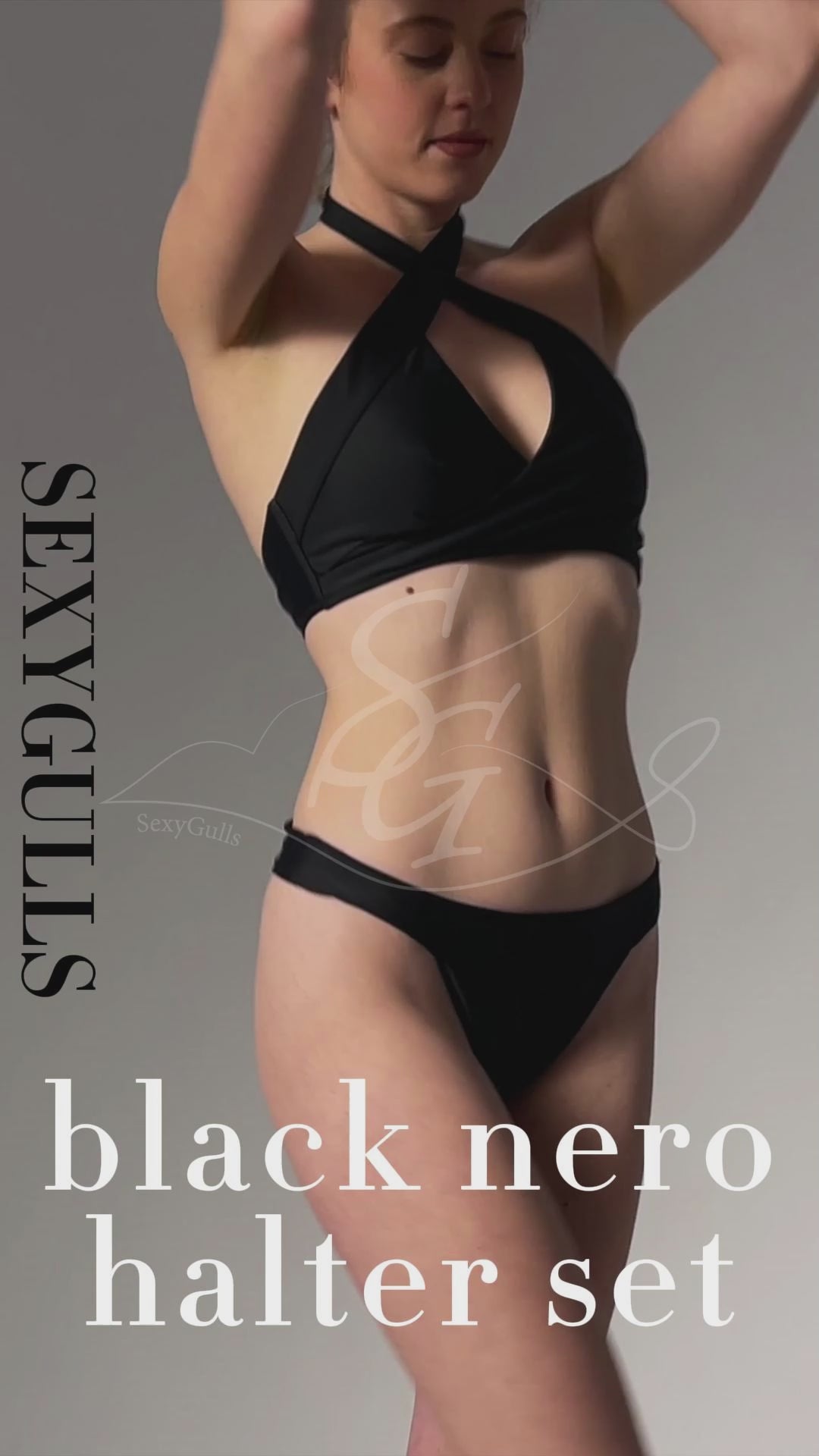 video of model wearing black halter bikini in studio